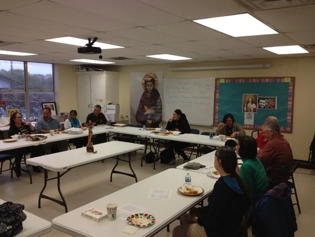 Fraternity members at a community gathering